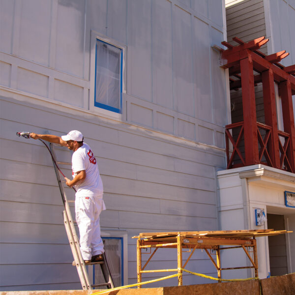 Titan Impact 400 XTRA using Titan RX-80 spraying exterior house with paint